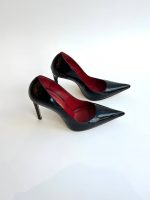 SHOES MADE OF GENUINE PATENT LEATHER IN BLACK WITH A RED INSOLE AND AN ELONGATED TOE